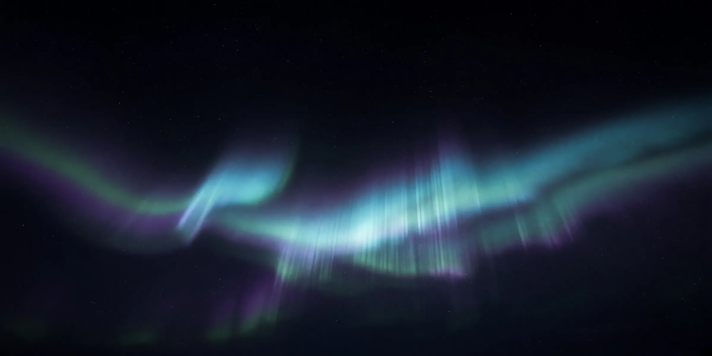 Aurora curtain over a dark horizon. Original Grok Imagine still. No software interface.